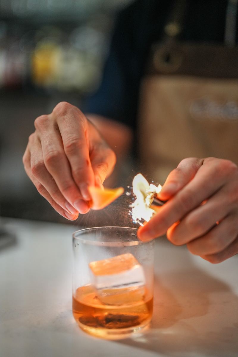 A cocktail being finished at the Tides bar
